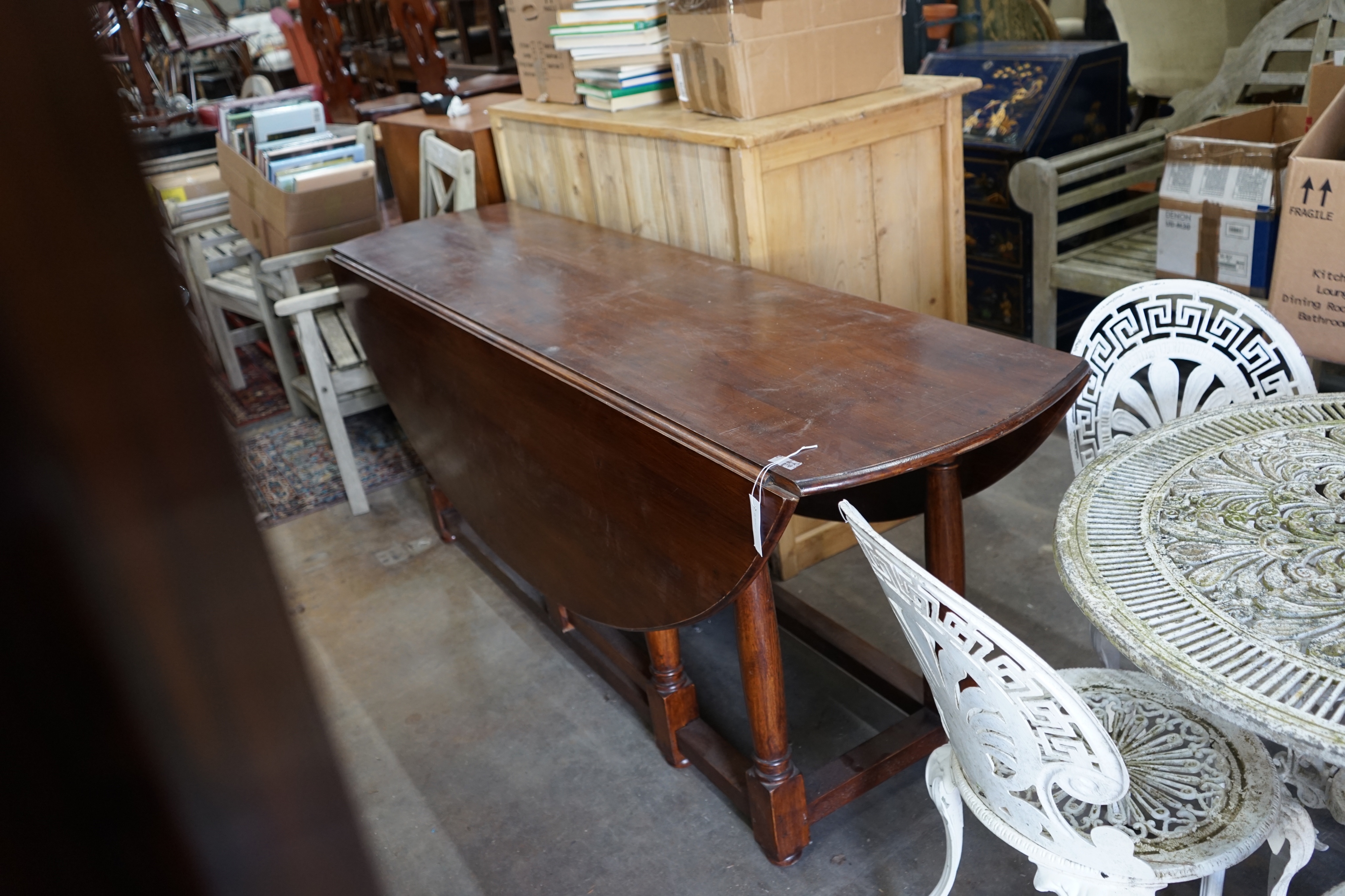 An 18th century style oak gateleg wake dining table, length 190cm extended 150cm height 79cm